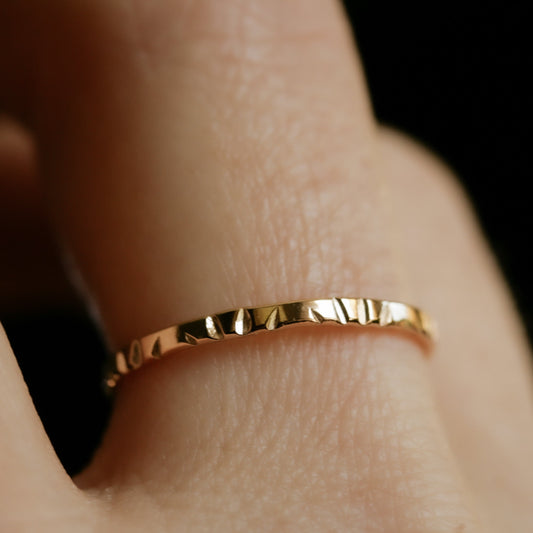 gold band with sun rays