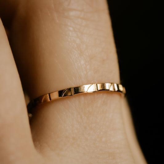gold band with waves pattern