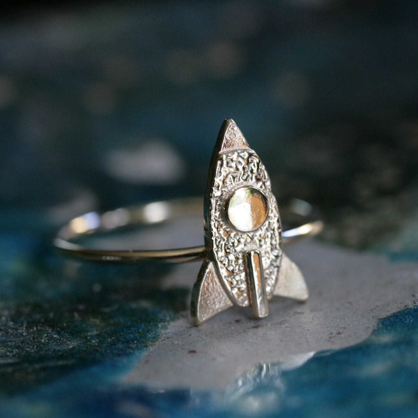 small gold spaceship ring