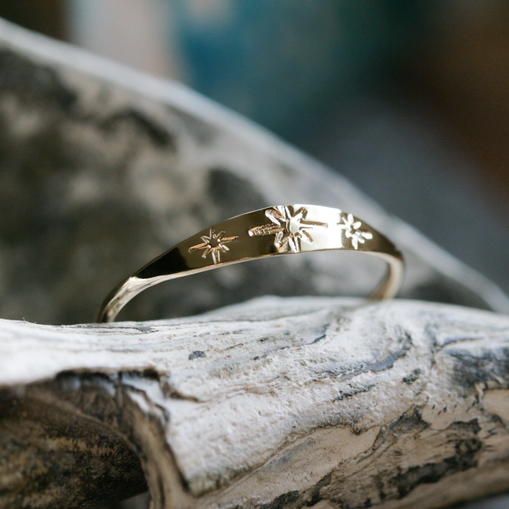 14k gold ring with three hand stamped stars